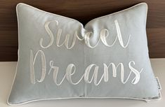 a pillow that says sweet dreams on it