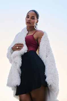 Don't forget a jacket – the season's staple is having a moment. This faux-fur number flaunts a high-low hem and subtle collar. | Faux-Fur Jacket by Daily Practice by Anthropologie in Beige, Women's, Size: 2XS, Polyester/Viscose/Elastane Chic Fluffy Fur Coat For Spring, Chic Fluffy Fur Coat, Chic Faux Fur Outerwear With Feather Trim, Chic Cold Weather Fur Coat With Faux Fur Trim, Chic Winter White Fur Coat For Cold Weather, Chic Winter White Outerwear With Faux Fur Trim, Winter White Faux Fur Coat For Fall, Chic White Fluffy Outerwear, Chic Winter White Outerwear With Faux Fur Lining