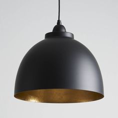 a gray and gold pendant light hanging from a ceiling