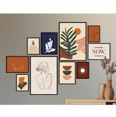 there are many framed pictures on the wall with plants in vases next to it