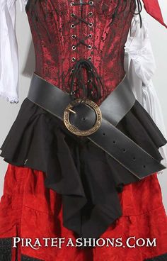 a red and black corset is displayed on a mannequin