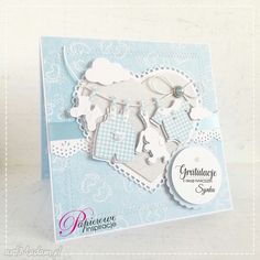 a blue and white card with some cut outs on it