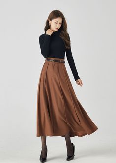 Winter Long Pleated Skirt, Yellow Skirt Outfit Winter, Brown Skirt For Fall, Winter Long Pleated Skirt In Solid Color, Brown Long Skirt For Winter, Winter Solid Color Pleated Maxi Skirt, Brown Long Skirt Bottoms For Winter, Brown Flowy Skirt For Fall, Winter Brown Fitted Maxi Skirt