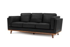 a black leather couch with wooden legs and armrests on an isolated white background