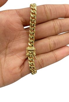 Marco's Jewelers Is Presenting You with This Absolutely Stunning Real 10k Yellow Gold Miami Cuban Link Bracelet 6mm, 8" Inches Long. The links are 10K GOLD and have a Lobster lock on bracelet. These Beautiful bracelet will not tarnish, discolor, or fade because they are Pure 10K Gold. We also have them in various another length. Please feel free to contact us if you have any queries regarding the item.  Our Store has obtained good recognition since 2014, with over 9000+ total orders successfully filled.  Texas Jewelers has been in gold and diamonds industry for over 25+ years, and as a result, we are able to provide some of the lowest prices on the web due to our direct sources of gold and diamond jewelry. Best of all, we offer *FREE shipping for all domestic orders!  Metal Purity  10K Yel Over 9000, Cuban Link Bracelet, Cuban Bracelet, Miami Cuban Link, Miami Cuban, Gold Top, Fine Jewelry Bracelets, Cuban Link, Bracelets And Charms