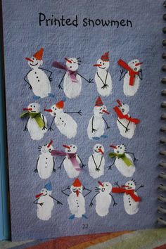 a notebook with snowmen drawn on it and the words printed in red, white and blue