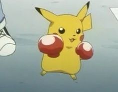 a pokemon pikachu with boxing gloves on