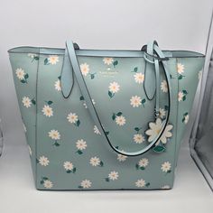 Brand: Kate Spade Style: Dancing Aster Printed Tote / K6078 Condition: New With Tag Exterior Color: Aphrodite Interior Features: Inside Zip And Multifunction Pockets Closure: Magnetic Snap Straps: Two Shoulder Straps Approx. Measurements: 15" L Across Top (Or 11.75" Across Bottom) X 11" H X 5.5" W Includes: Floral Hangtag No Lowball Offers Or Trades Please. I Do Not Discuss Prices On Listings. Thank You For Looking! Kate Spade Designer, Kate Spade Minnie Mouse, Black Spades, Kate Spade Style, Tan Handbags, Bags Kate Spade, Kate Spade Totes, Kate Spade Tote Bag, White Tote