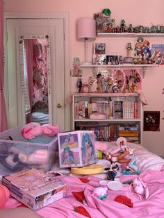 a bedroom with pink walls and toys on the bed