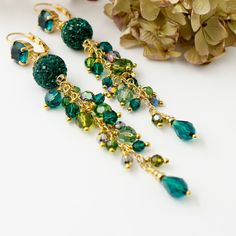 "Handmade earrings embellished with Emerald Green Crystals...romantic yet elegant earrings for any occasion... These earrings look beautiful and you can wear with almost anything. These earrings made of: ...rhinestones Pave bead (12 mm) with Emerald  Premium Quality Crystal ... ...Pear drop Emerald Premium Quality Crystal (8 mm) ... ...faceted round Olivine Ab, Vitraill Medium, Peridot and Emerald Premium Quality Crystal ... ...brass gold plated post ear wire studded with Emerald Premium Quality Crystal (8 mm)... These earrings measures about 3 7/8 \"including lever back ear wires. All metal components are brass gold plated (lead, nickel free, hypoallergenic). These earrings are packaging in an elegant gift box ready for gift giving. These earrings you can wear with matching bracelets or n Emerald Green Earrings, Pave Beads, Wedding Bridal Jewellery, Earrings Green, Wedding Jewelry Earrings, Green Earrings, Brass Gold, Rhinestone Jewelry, Matching Bracelets