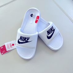 Brand New!!! Nike Slides With Enhanced Soft Materials Making It Super Comfy. Color Is White With Black. Final Sale. No Return Or Exchange Nike White Sandals For Spring, Nike White Sandals For Streetwear, White Nike Sandals For Streetwear, Comfortable White Nike Slides, White Non-slip Sandals For Streetwear, Non-slip White Sandals For Streetwear, White Low-top Sporty Slides, White Sporty Sandals For Streetwear, Comfortable White Low-top Sandals