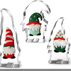 three cookie cutters shaped like christmas gnomes