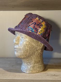 a crocheted hat on top of a mannequin head