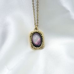 This Eye-Catching Aurora Borealis Gemstone Pendant Necklace Is Crafted From Stainless Steel And Is Waterproof For Durability And Wearability. The Unique Gemstone Pendant Exudes A Colorful Glow In An Aurora Borealis Pattern, Making It A Great Accessory For Casual Wear Or As A Special Gift. Color: Gold Length: 17.5 Inches Material: Stainless Steel, Gemstone Purple Metal Clavicle Chain Necklace, Elegant Purple Metal Necklace, Purple Metal Pendant Necklaces, Purple Clavicle Chain Pendant Necklace, Gemstone Pendant Necklace, Gemstone Necklace Pendant, Pendant Gold, Unique Gemstones, Gold Pendant Necklace