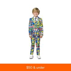 a young boy wearing a colorful suit and tie with cartoon characters all over the suit