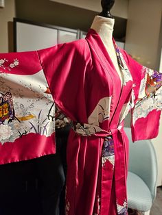 This is such a beautiful Vintage Japanese Kimono robe. It can be worn as a house robe or wear it out, throw on some skinny jeans, high heels , black tank and hit up the town. Your sure to get many compliments. It's pink with a rickshaw/floral print. The fabric is polyester, feels so soft and silky. The length is 56 inches, Its a one size fits most. It is a traditional kimono with open sleeves which are nice and long, comes with a matching fabric belt. Its in great condition.  This item is pre-lo Long Kimono For Home, Traditional Kimono Sleeve Robe For Home, Traditional Robe With Kimono Sleeves For Home, Long Red Kimono For Loungewear, Silk Home Kimono With Kimono Sleeves, Traditional Kimono, Vintage Japanese Kimono, Long Kimono, Kyoto Japan