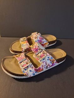 Women's size 6 Steve Madden white and flowered adjustable slide On sandles. Condition is pictured Casual Slip-on Sandals With Floral Print, Casual Floral Print Slip-on Sandals, White Slides With Buckle Closure For Spring, White Slide Footbed Sandals For Summer, White Summer Slide Footbed Sandals, Steve Madden Slides, Slides, Steve Madden, Women's Shoes Sandals