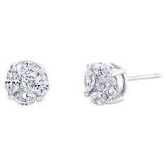 These diamond earrings give the illusion of larger single diamond studs! In fact, each earring is comprised of a single princess cut diamond framed by 4 marquise cut diamonds. While the total carat weight of these diamonds is .78 carats, each earring looks like a one carat diamond! Magic! An extraordinarily luxurious look that is much easier on the pocketbook, as single diamond studs with this degree of fine color and clarity would cost significantly more. A classic look and a practical purchase. Handmade in 18k white gold by our Master Jewelers in Los Angeles. Everyone should have a pair of diamond studs in their fine jewelry wardrobe! Diamonds, .85 carat total These earrings are also available in other sizes: EA-1421 $1740 "looks like 1.50 carats total" - actual weight .58 carats total E Diamond Cluster Earrings, White Gold Earrings Studs, White Gold Studs, Customized Jewelry, Princess Cut Diamond, Round Stud Earrings, Diamond Stud Earrings, Marquise Diamond, Cluster Earrings