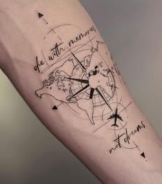 a person with a tattoo on their arm that has a map and compass in it