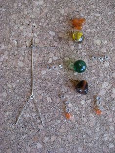 several different colored glass beads on the ground