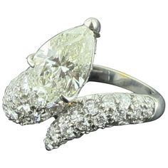 an engagement ring with two pear shaped diamonds