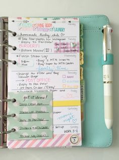 a planner with notes and pen on it