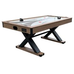 an air hockey table is shown with the top down and one leg extended to it