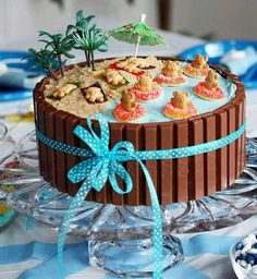 a chocolate cake decorated with cookies and palm trees