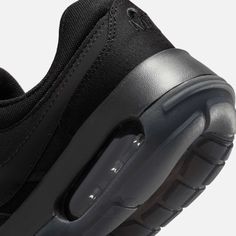 the nike air max is black and has a rubber outsolet on top of it