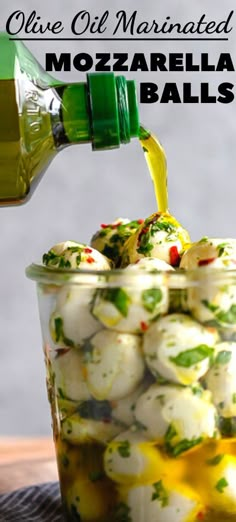 olive oil marinated mozzarella balls in a glass jar with lemon zest