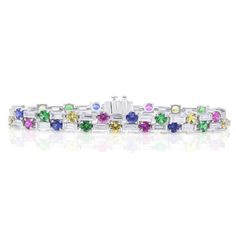 This exquisite bracelet is crafted of polished platinum and contains 34 baguette diamonds of the absolute highest quality weighing 4.45 carats and 34 round multi-colored sapphires weighing 9.36 carats. Colored Sapphires, Baguette Diamonds, Baguette Diamond, Multi Colored, Platinum, Sapphire, Diamonds, Bracelet, Color