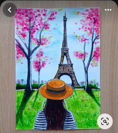 a painting of the eiffel tower with a woman's hat on her head