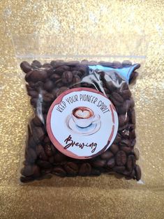 a bag of coffee beans sitting on top of a table