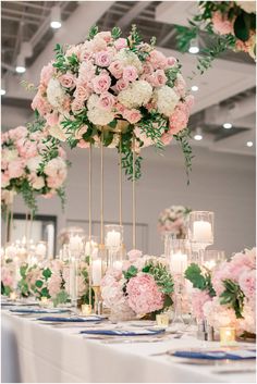 the centerpieces are filled with pink and white flowers