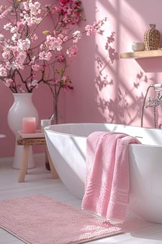 a bathroom with pink walls and flooring in the bathtub is decorated with flowers