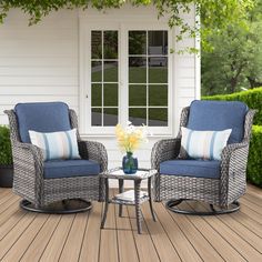 two chairs and a table on a wooden deck