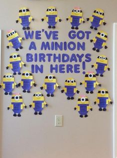 a bulletin board with minion birthday decorations on it