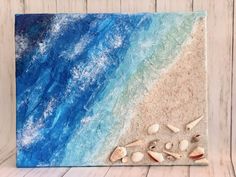 an ocean scene with seashells and sand on the beach, painted in acrylic paint