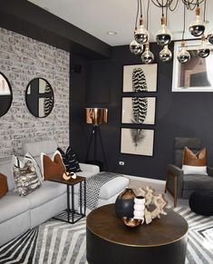 a living room filled with lots of furniture next to a white brick wall and floor