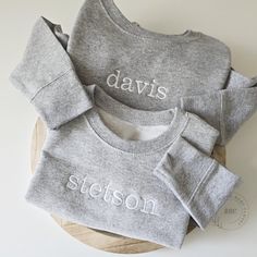 Toddler Sweatshirts: -- Light Weight Sweatshirts -- 55% Cotton 45% Polyester - Oatmeal Heather Color -- 60/40 cotton/polyester -  Black, White, Red, Grey Color. -- White Sweatshirt is sewn with 100% cotton thread -- Coverstitched collar, shoulders, armholes, ribbed cuffs and waistband Boho Baby Closet is known for high-quality products because we pay attention to detail and aim to exceed your expectations.  All our clothes are Ethically Made / Sweat Shop-free, assuring they meet our high standar Family Matching Embroidered Long Sleeve Sweatshirt, Cozy Long Sleeve Tops With Letter Embroidery, Family Matching Cotton Sweatshirt For Winter, Basic Winter Tops With Embroidered Logo, Heather Grey Cotton Top With Embroidered Logo, Gray Long Sleeve Top With Letter Embroidery, Gray Embroidered Winter Tops, Gray Long Sleeve Top With Embroidered Text, Name Sweatshirt