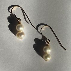 Classic beauties to throw on walking out the door. Whether going to work, getting coffee, or even a wedding these are the perfect earrings for any occasion. They are made with cultured pearls and gold filled materials. They are safe to wear in water, but should stay away from chemicals like soaps, lotions, and perfumes. Walking Out The Door, Walking Out, Shoe Charms, Classic Beauty, In Water, Cultured Pearls, Going To Work, The Door, Shop Necklaces