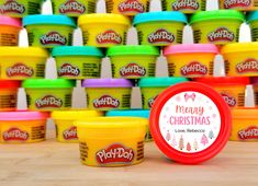 play - doh's christmas ice cream is displayed in front of many colorful cups