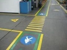 an empty street with yellow and blue markings