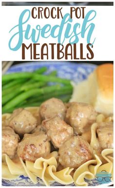 crock pot swedish meatballs with green beans on a blue and white plate next to bread