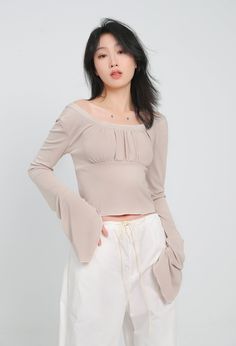 With all the comfort of a casual tee and the style of a dressy top, this crop top is a must-have for your wardrobe. A lightweight and airy fabric makes this crop top a perfect choice for a hot day or a night out on the town. The ruched front detail adds a touch of glamour, while the flare sleeves keep things interesting.
Gender: WomenMaterial: PolyesterClothing Length: ShortSleeve Length: Long SleeveSleeve Type: Angel Sleeve Trendy Crop Top In Solid Color, Solid Color Trendy Crop Top, Chic Fitted Crop Top, Fitted Solid Color Top For Spring, Casual Fitted Off-shoulder Crop Top, Chic Spring Crop Top For Day Out, Trendy Solid Color Crop Top For Day Out, Solid Color Cropped Knit Top, Fitted Cropped Top