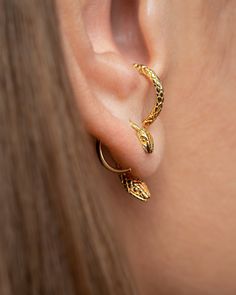 "Adorn your ears with this cute and stylish snake earring set, including gold plated hoop earrings that make a statement in animal jewelry fashion. These elegant earrings are the perfect accessory to enhance any outfit, adding a touch of whimsical charm and sophisticated charm. Embrace your wild side with these unique and eye-catching earrings that are sure to make you stand out from the crowd. Perfect for snake lovers and fashionistas alike, these earrings are a must-have addition to your jewelry collection. Set of Snake-shaped earrings, made in 24K gold-plated sterling silver or oxidized sterling silver. H O W  T O  O R D E R * Please use the drop-down menu to select your preference: * Select which of the snake combinaciones you would like. * Use the drop-down menu: * Select the quantity Serpent Jewelry, Snake Lovers, Cute Snake, Snake Earrings, Minimalist Gifts, Ear Jacket, Animal Earrings, Stylish Earring, The Snake