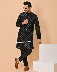 HANDMADEKURTASHOP  Description Man kurta for Man Give yourself a best ethnic look by wearing this Top and bottom Set. Made of rich cotton silk blend fabric this regular-fit set comprises a full-sleeved Indian kurta pajama This outfit with mojris will look apart on special occasions. material 100%Cotton Color : Black color  Kurta Length : 40 inches Kurta Pajama set Mirror work kurta  Shirt Chest is measurement for shirt (not body) As per standard, for best loose fitting 6 inches gap should be there between actual chest size and shirt chest size Size chart is below Men's Sizes Actual Body Chest - Ready Shirt Chest i Add 6" Inches Lose Fitting Fabric Armhole To Armhole. XS - 30" Inches 36" Inches S - 34" Inches 40" Inches M - 36" Inche 42" Inches L - 40" Inches 46" Inches XL - 44" Inches 50" Long Sleeve Kurta With Mirror Work For Eid, Black Churidar For Eid, Eid Straight Kurta With Mirror Work, Kurta Men, Indian Kurta, Ethnic Looks, Mirror Work, Cotton Silk, Full Sleeve