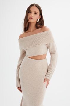 Expertly crafted with a wool blend enhanced by luxurious cashmere, the AVANI off shoulder cropped top in stone offers both softness and style. This knitted piece features a fold bardot neckline, long fitted sleeves, and a cropped body length for a modern, fitted silhouette. Stay warm and chic with this must-have addition to your wardrobe. Fabric and Fit: Wool Blend Enhanced with Cashmere 95% Wool, 5% Cashmere Stretch Factor: Stretchy Garment Length from Top Neckline to Hem: Approx 23cm Model Wea Bardot Crop Top, Top Neckline, Bardot Neckline, Ni Idea, Fitted Sleeves, Off Shoulder Crop Top, Shoulder Crop Top