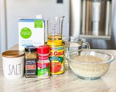 the ingredients for this dish are on the counter top, including rice and seasoning