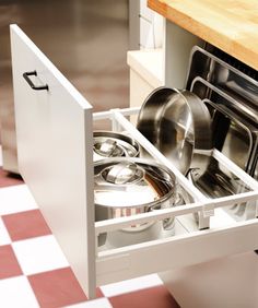 an open dishwasher drawer in a kitchen